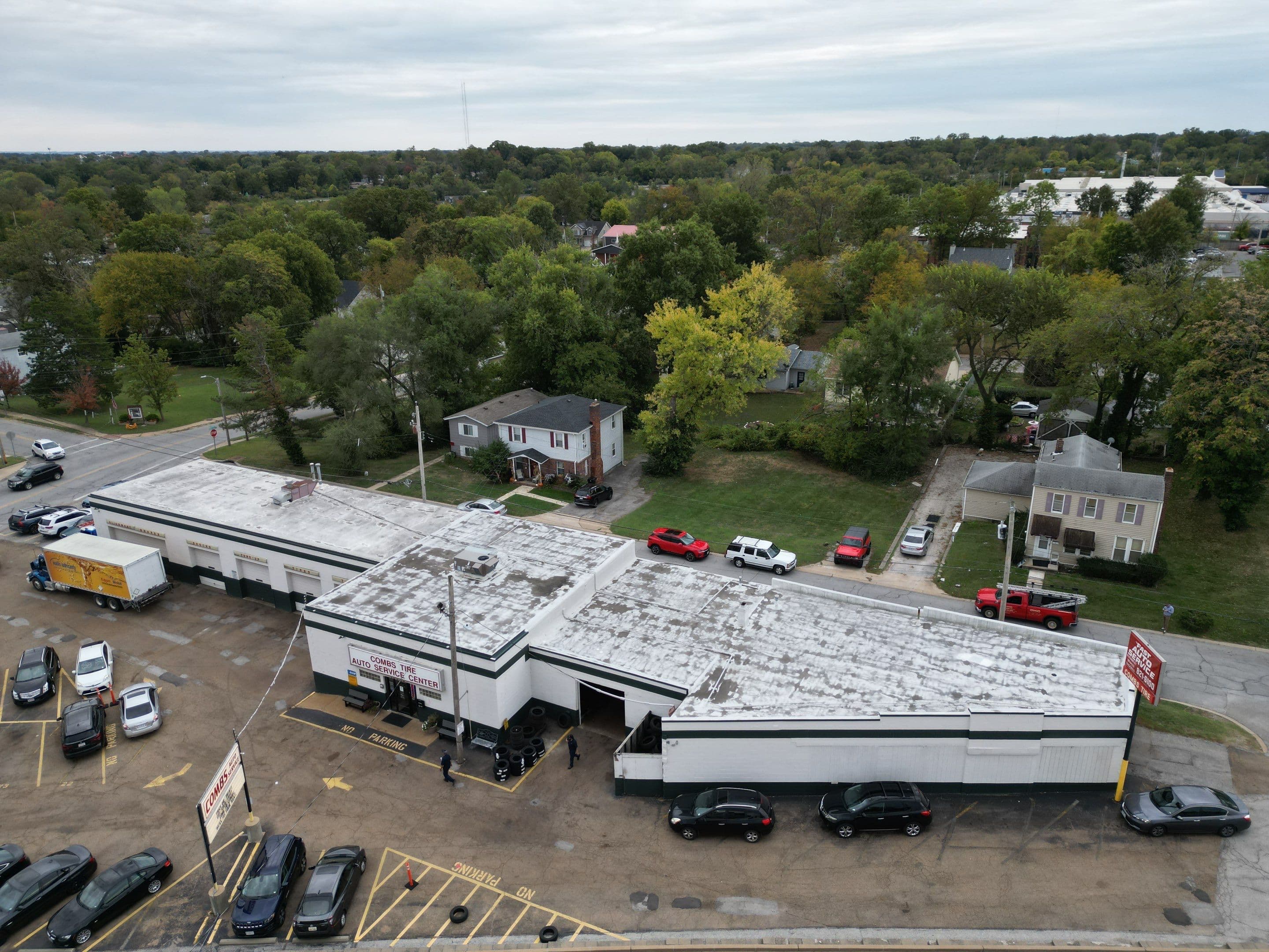 Before — Commercial Flat Roof TPO Membrane Replacement — Auto Service Center
