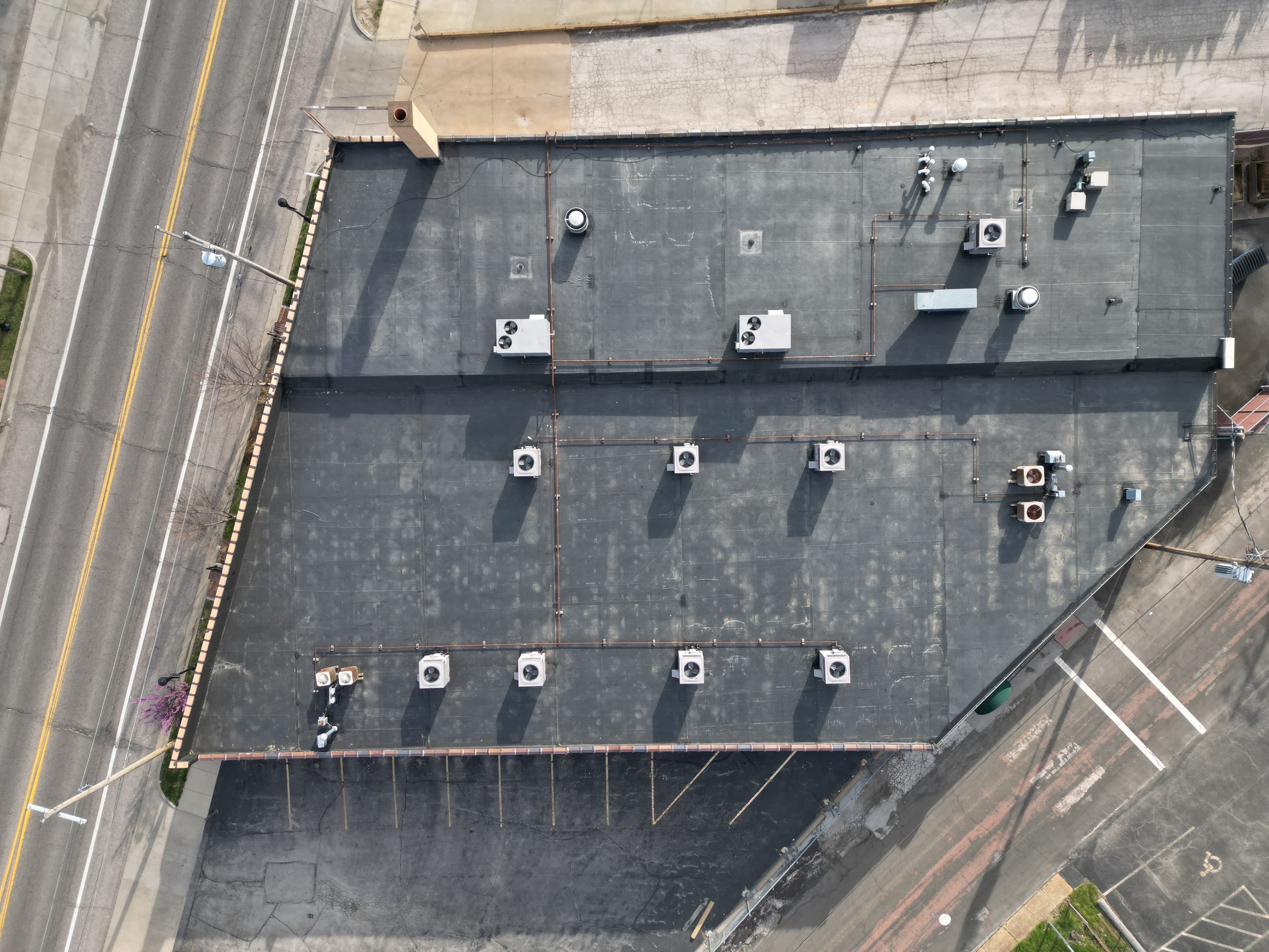 After — Large-Scale Commercial EPDM Flat Roof Replacement — Retail Strip Building