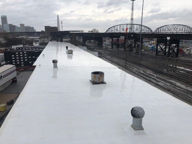 After — Industrial Warehouse Metal Roof Restoration Coating — Rail Corridor Facility